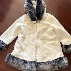 Fashionable black and white short coat with fur on edges and also has a hoodie and lining inside