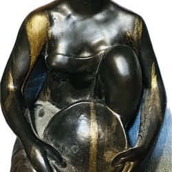 Bronze sculpture titled "Humble Beginnings" by Irish ceramicist Annemarie Mullan