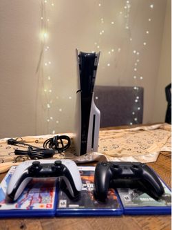 Excellent condition PlayStation 5 PS5 (Slim)1TB with 2 dual sense controllers and 4 Games Combo