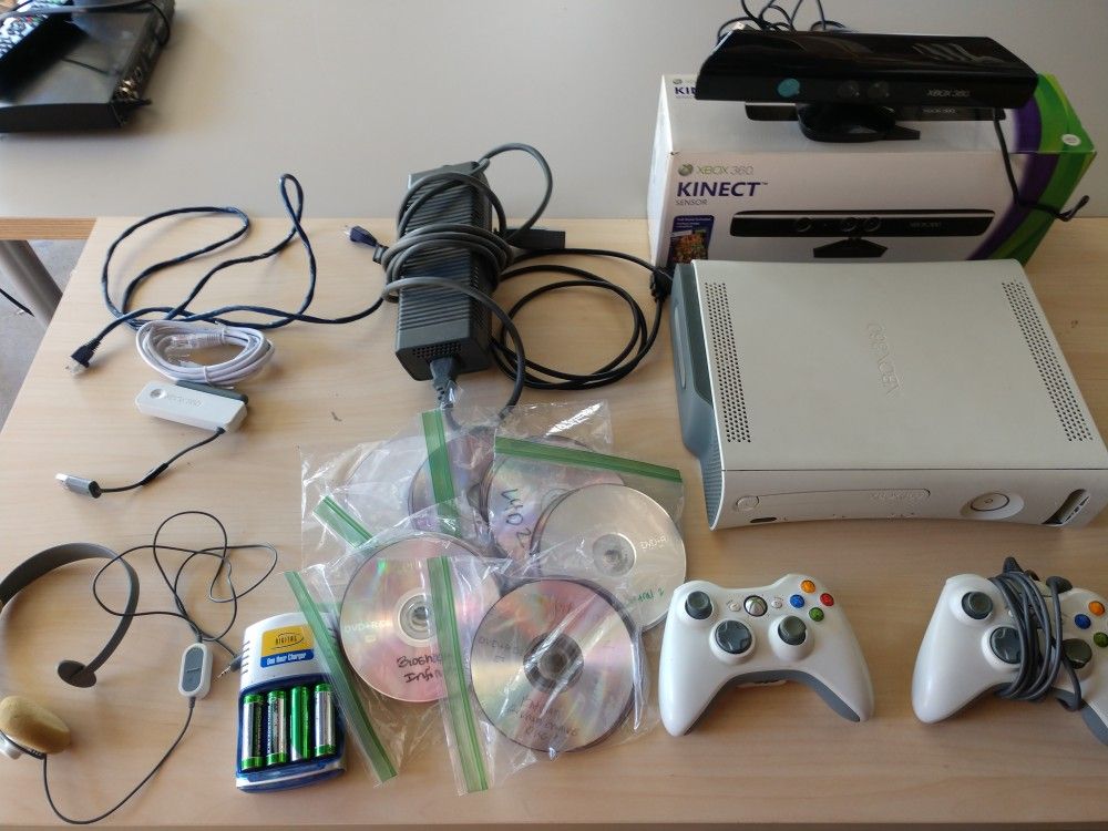 Modded Xbox 360, Kinect, 2 Controllers, wireless network adaptor, 55 games, and headset