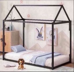 Children’s black metal floor bed