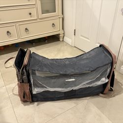 Pink diaper bag backpack with a built-in changing station