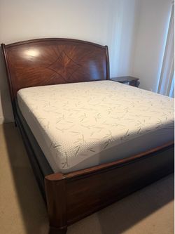 King size bed with mattress and upright dresser