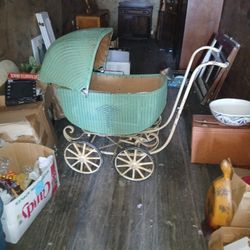 An antique baby stroller.