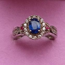Blue Shappire and Diamonds With Two Ruby's Ring