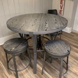 Round Table With Four Rotating Stools 