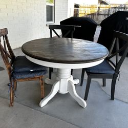 Table And Three Chairs