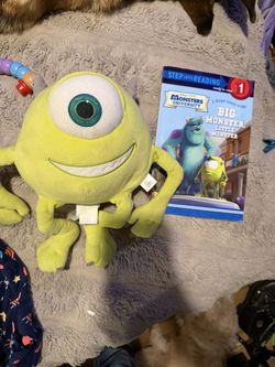 The image features a Disney/Pixar Mike Wazowski plush toy and a matching book. 
