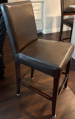4 brown counter height chairs