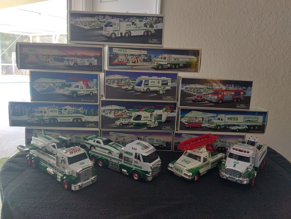 AMAZING HESS TRUCK COLLECTION. (12) NEW IN THE BOX AND (4) NEW NOT IN THE BOX. (16) VEHICLES IN TOTAL.