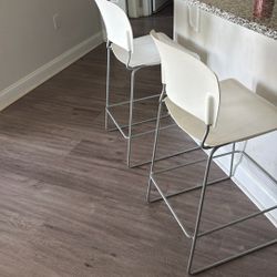 Three White Countertop Chairs