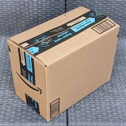 Clean small size cardboard box with foam packing peanuts for shipping moving or storage