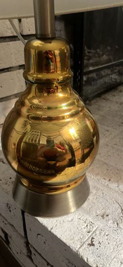 2 lamps medium size gold colored with squiggly black designs
