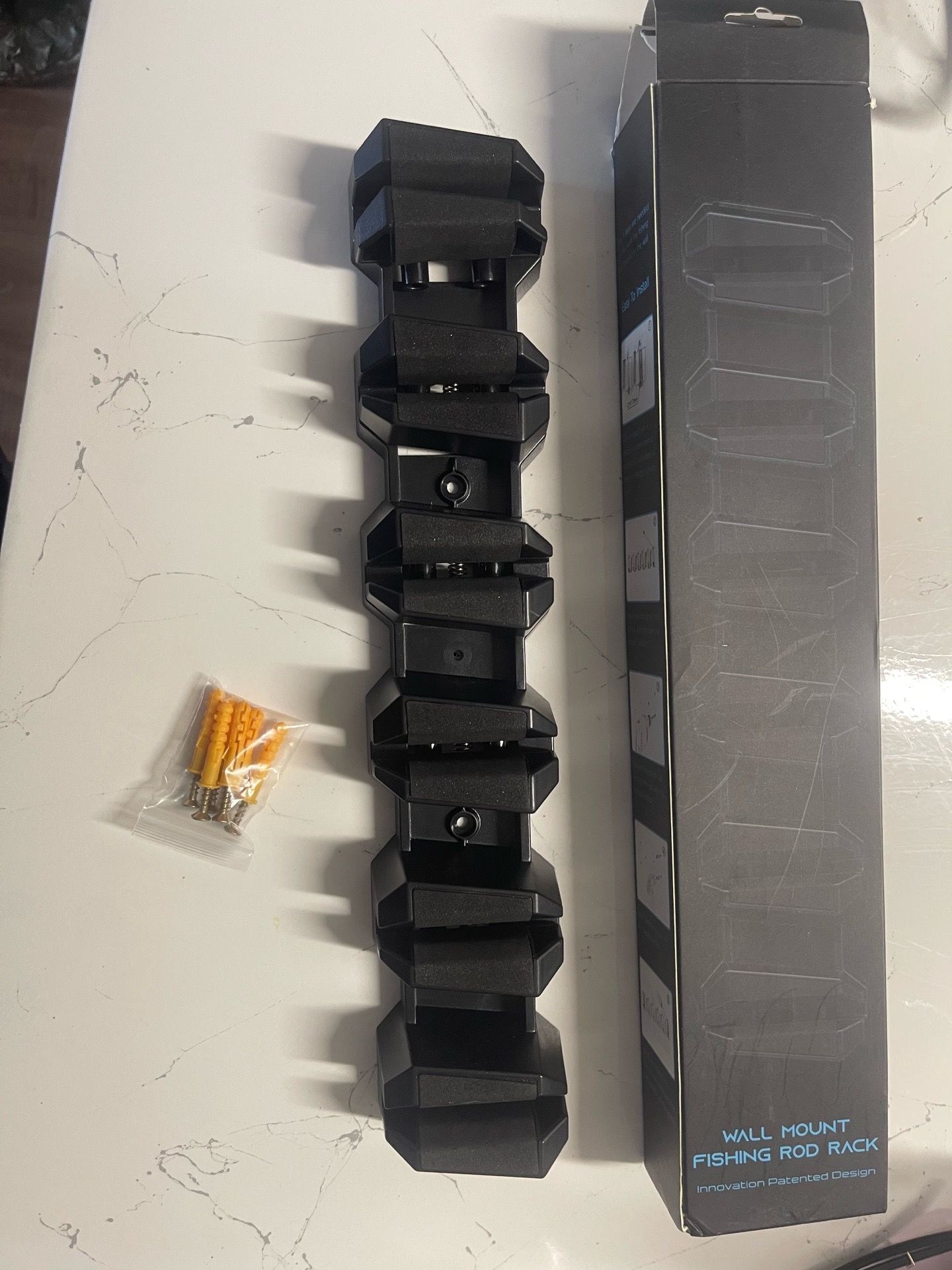 Wall mount fishing rod holders