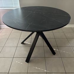 Round gray table with (4) chairs