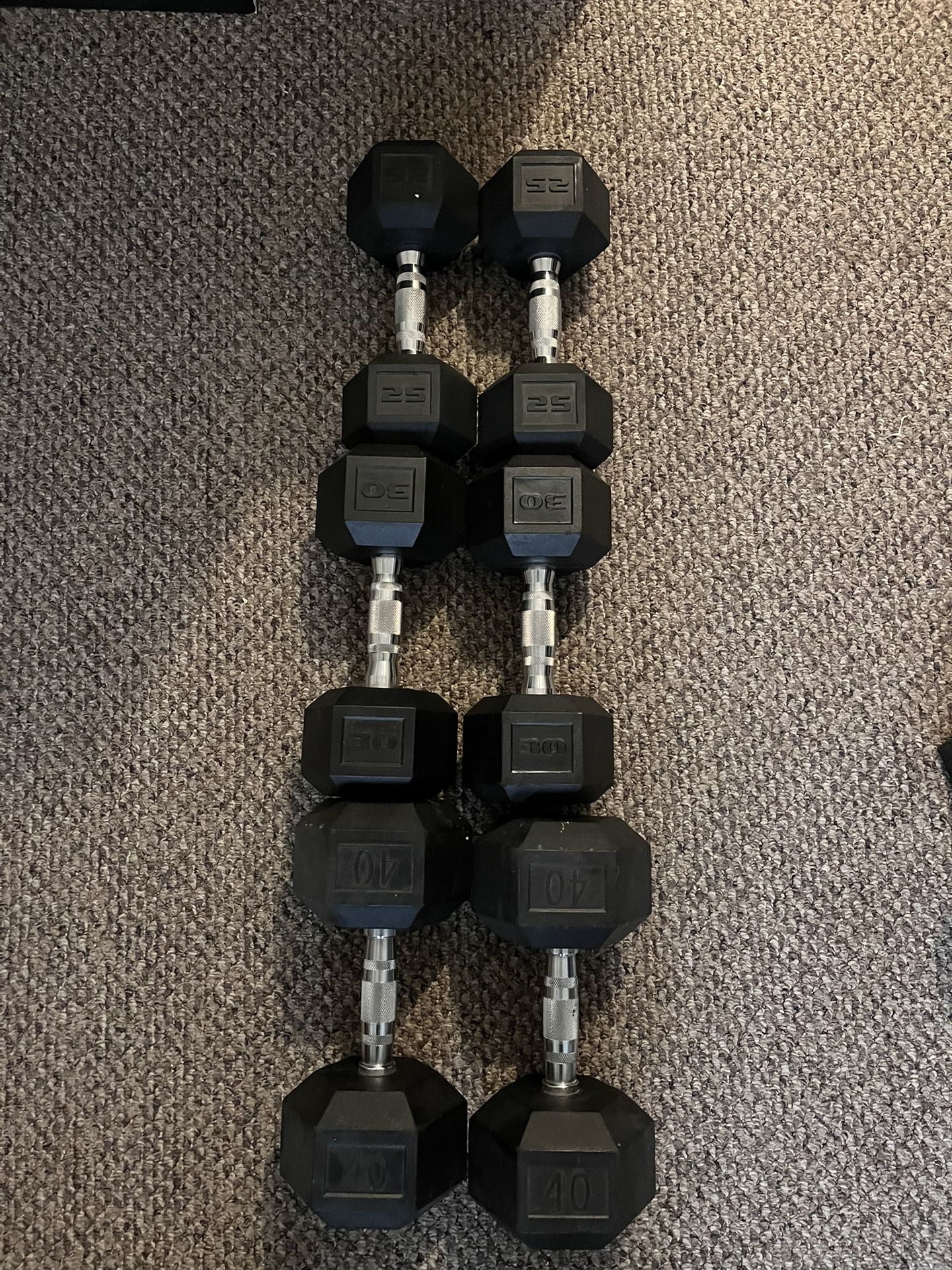 Dumbbells 40 Lbs, 30 Lbs, And 25 Lbs