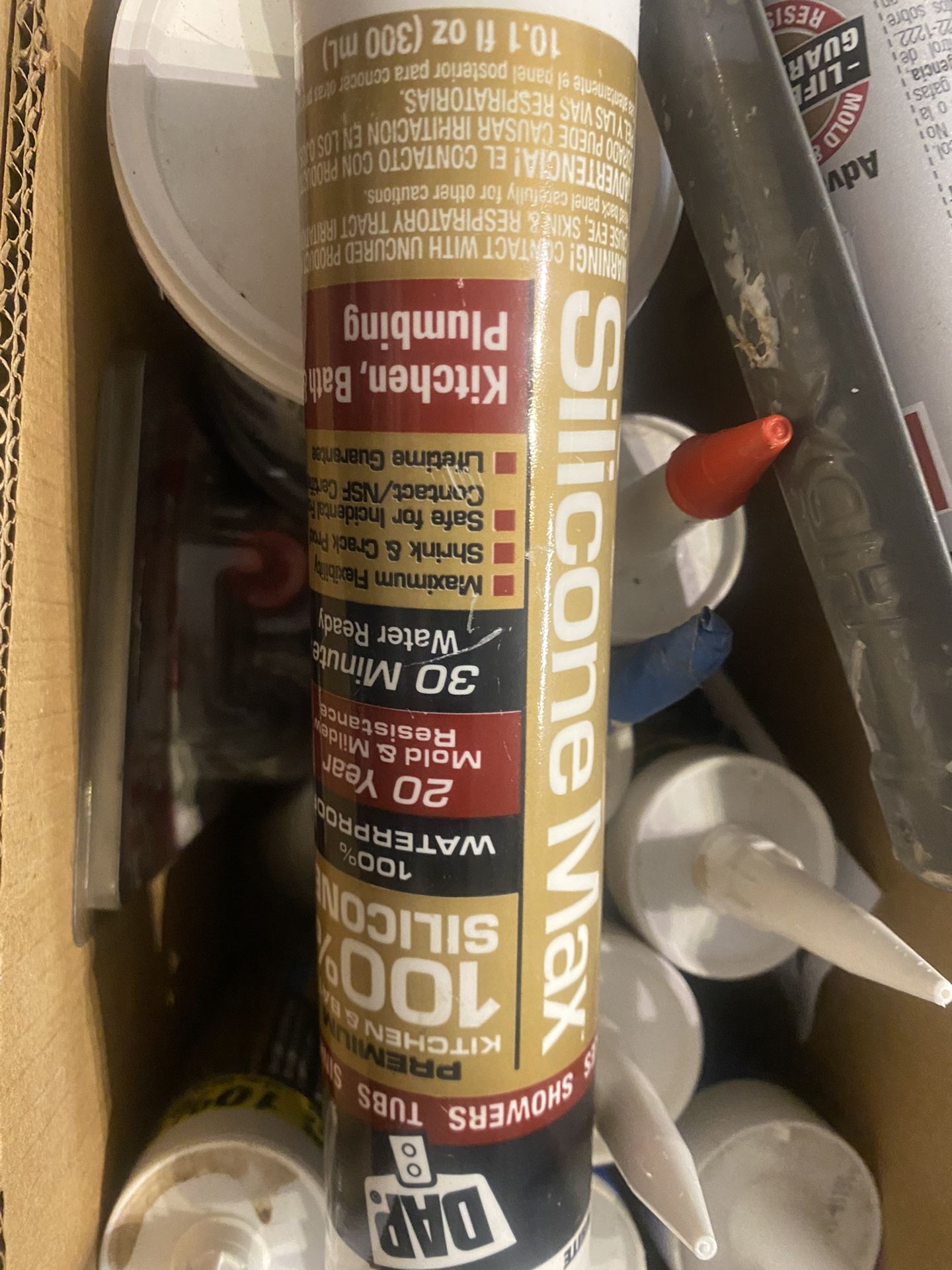 Box Of Various Caulks And Waxes