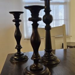 Set of 3 Pottery Barn Turned Wood Candleholders.

Two of 16.6" H
One of 24.75" H
