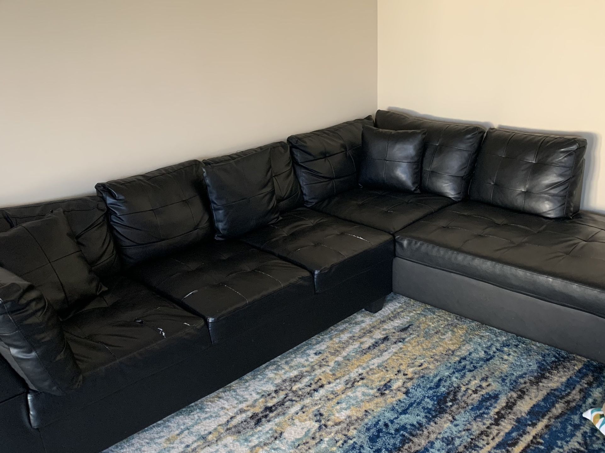 Black Sectional Sofa With Few Tears On Sale