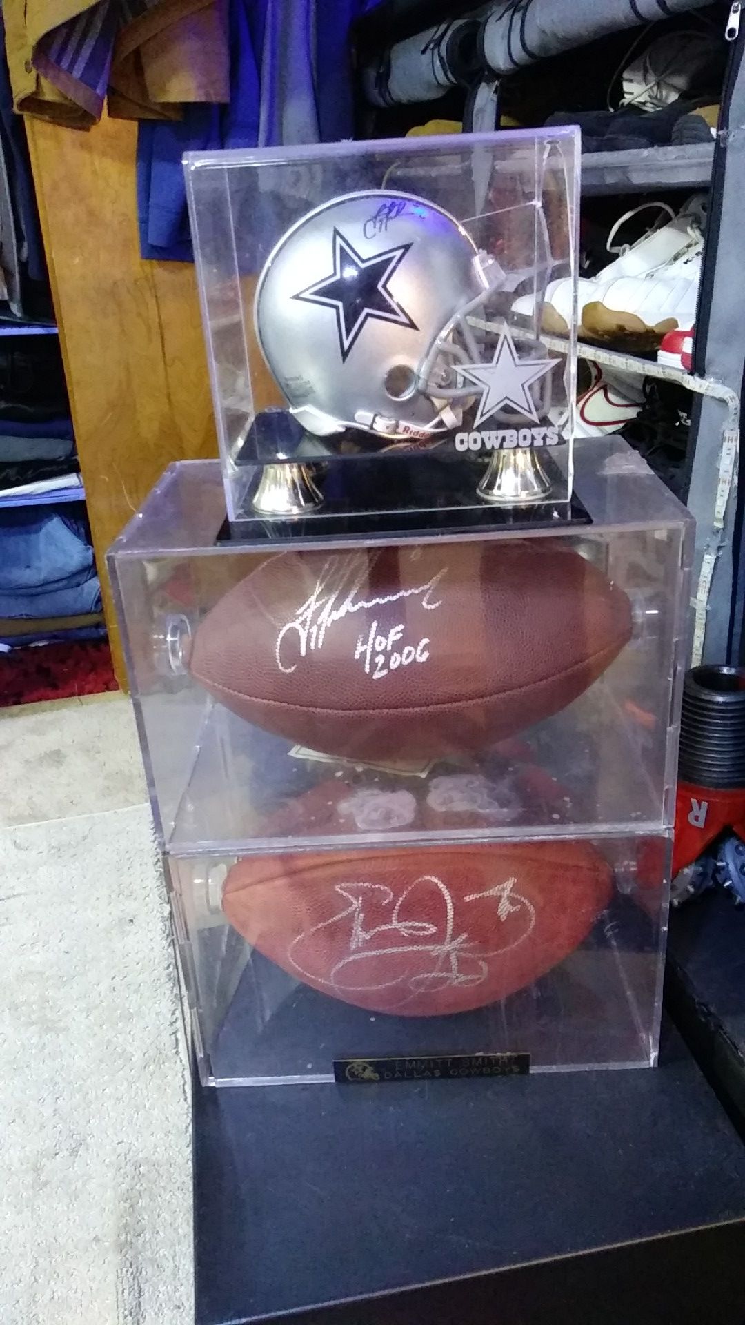 Autographed Dallas Cowboys items. Troy Aikman HOF ball. Emmitt Smith ball and Troy Aikman mini helmet all three are in cases and come with COA