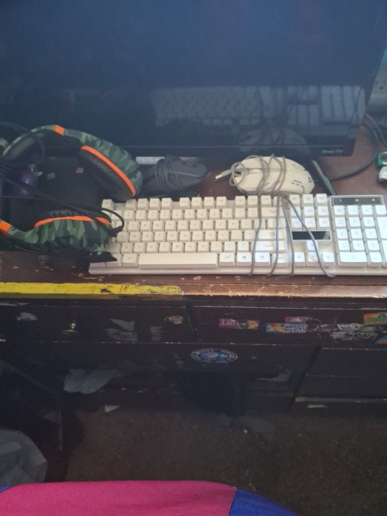 Keyboard And Mouses And A Pair Of Headphones