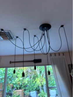 Light fixture pendant light with Edison bulbs included.
