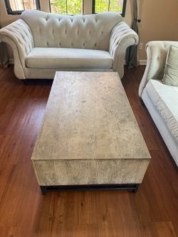 Rustic Wood Coffee Table with Metal Base and Couches