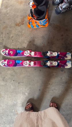 Girl ski with ski boots