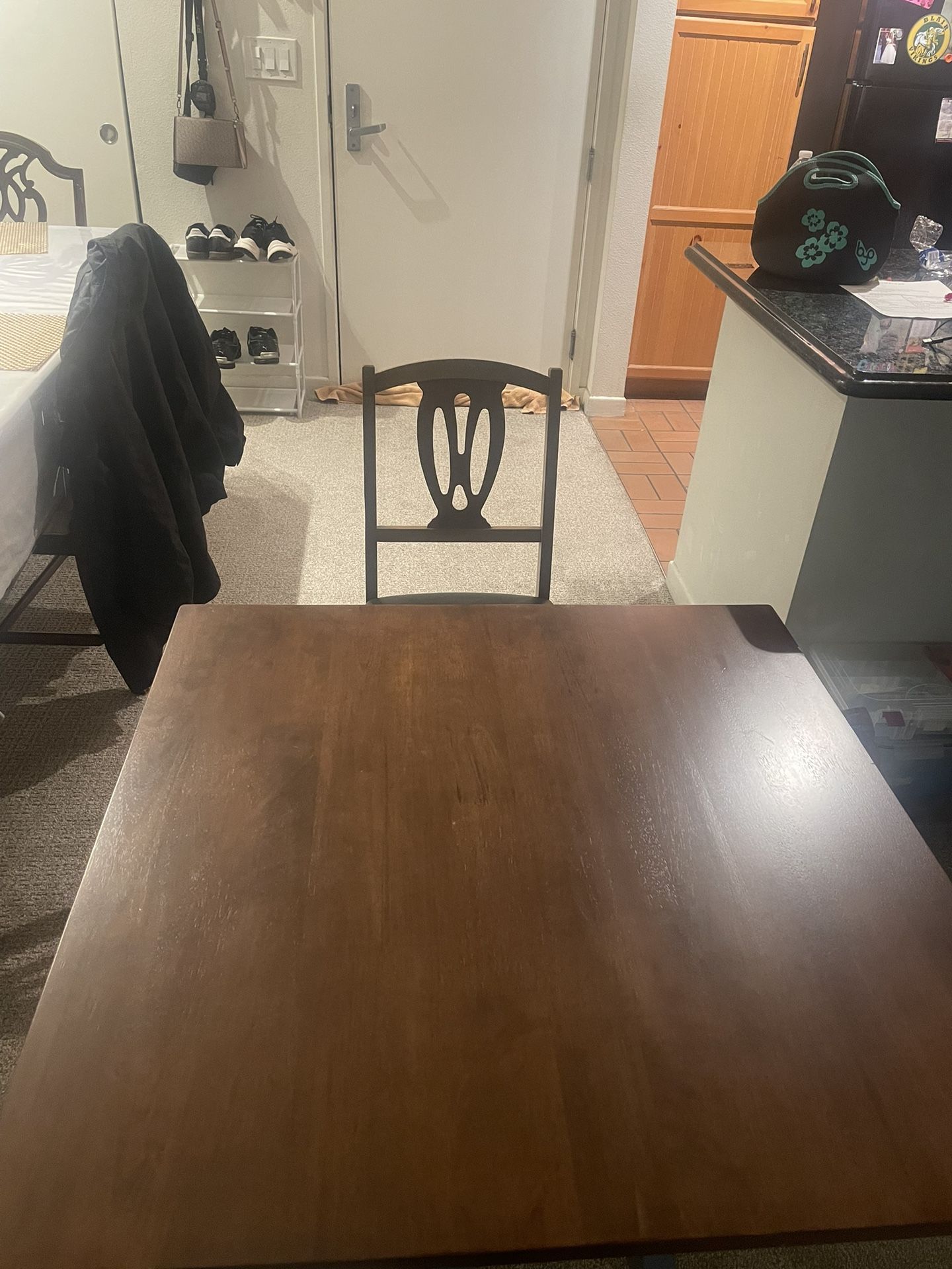 Brown Wooden Table With Four Wood Chairs