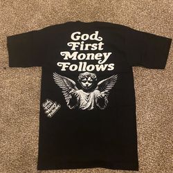 Black shirt god first