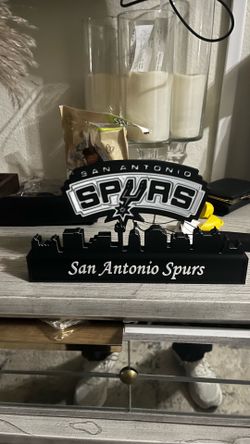 San Antonio SPURS with skyline of San Antonio