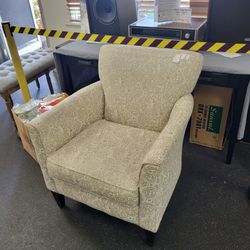 Armchair. Comfortable. Neutral color scheme