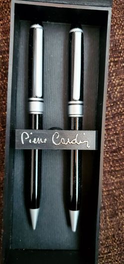 Pierre Cardin black ballpoint pen and mechanical pencil set in a presentation box.