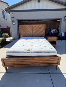 Queen bed with two nightstands