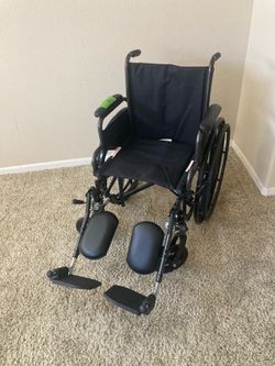 Wheelchair New with Elevating Footrests