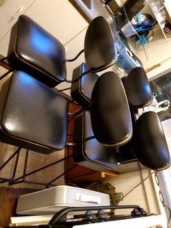 Antique black leather bar stools.