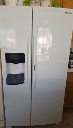 Samsung side-by-side refrigerator in white.
