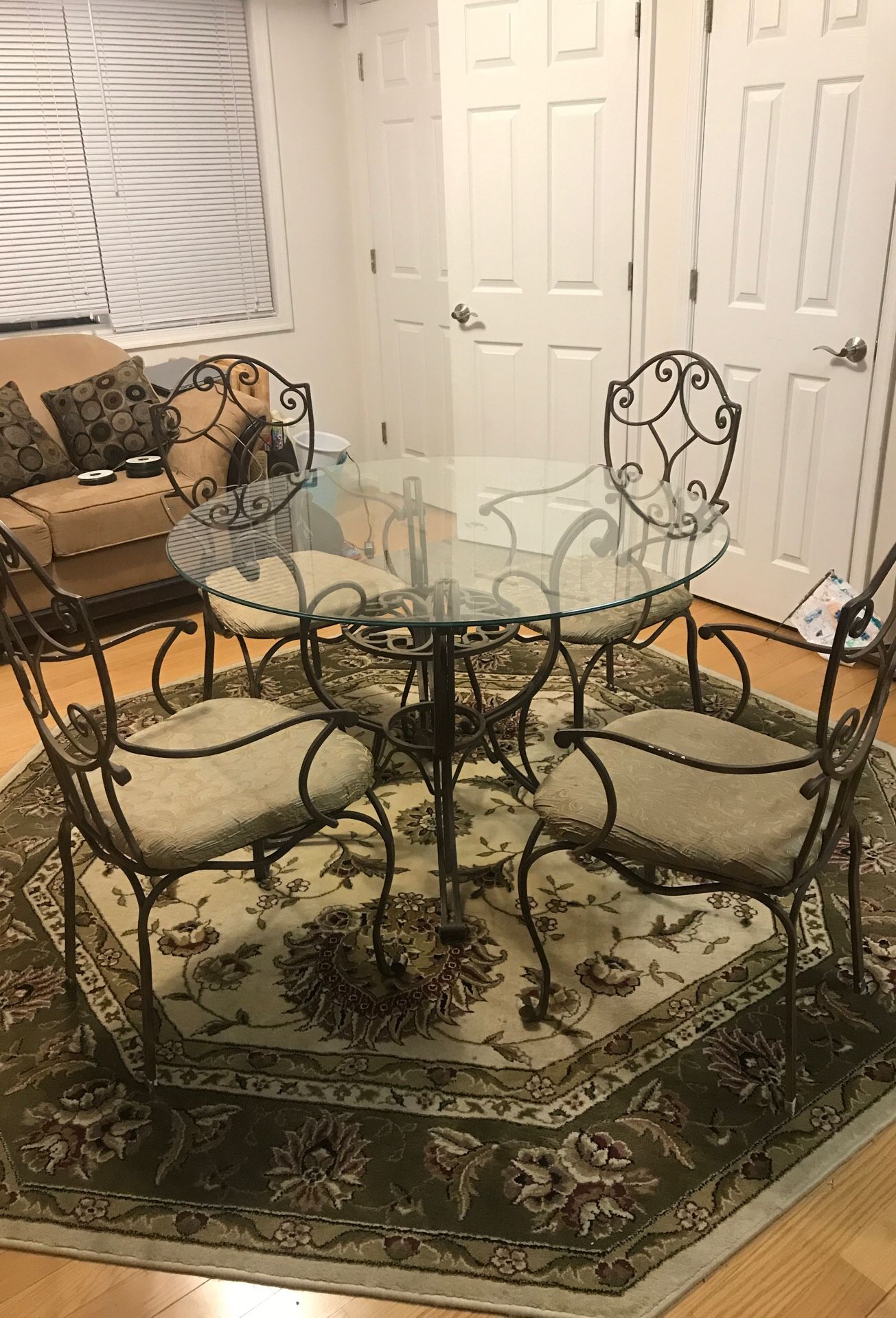 Glass kitchen table with rod iron chairs