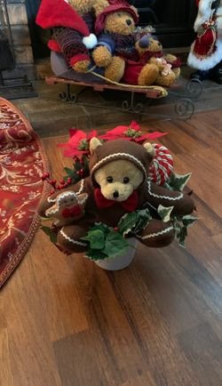 Poinsettia Christmas plant with bear and gingerbread cookie