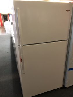 New scratch and dent whirlpool 21 cu ft top and bottom fridge. 1 year warranty