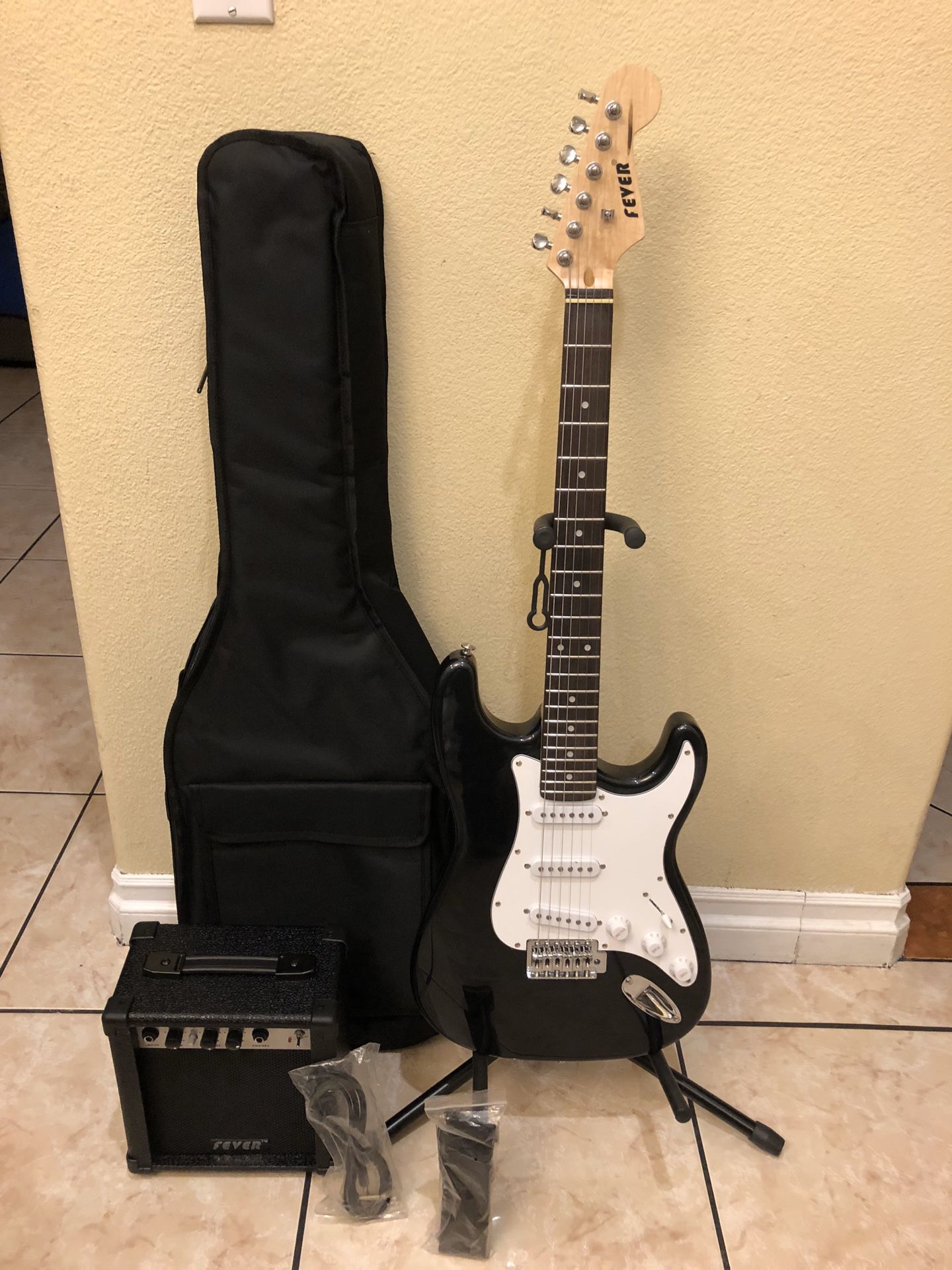 Fever electric guitar with case amp cable and strap