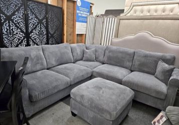 Stunning sectional sofa with ottoman grey corduo