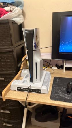 ps5 with cooling system and a remote with cod