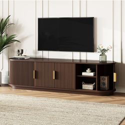**Assembled** wooden TV Stand with Sliding Tambour Door for TVs up to 75" in walnut brown finish.