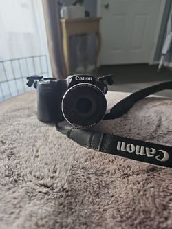 black Canon PowerShot SX510 HS digital camera featuring a 30x optical zoom lens.