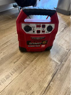 Portable 12 volt jump starter and power source.