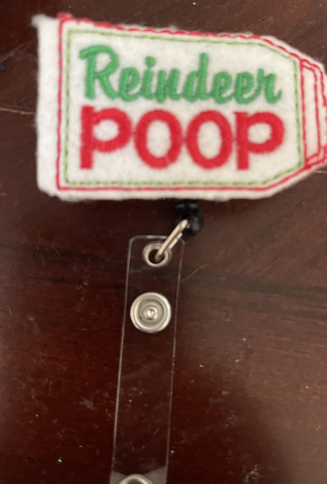 Reindeer Poop Badge Reel