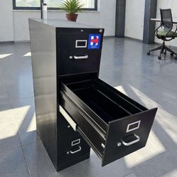 Commercial grade black HON brand 4-drawer standard / letter size metal file cabinet. 15 W x 27 deep x 52 1/2 H.