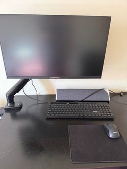 27” monitor. Bluetooth keyboard and mouse. Monitor arm. Speaker. Hdmi cable