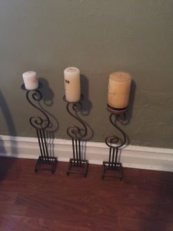 three candle holders without the candles